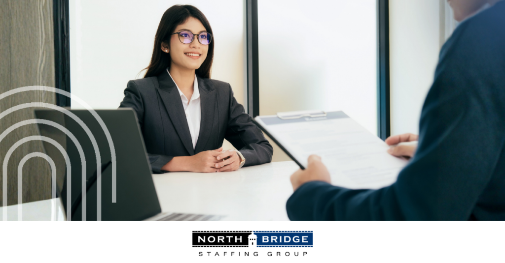 A job applicant sits confidently in a high-stakes job interview.