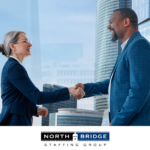 An organization leader shakes hands to seal the deal with a recruiting partner