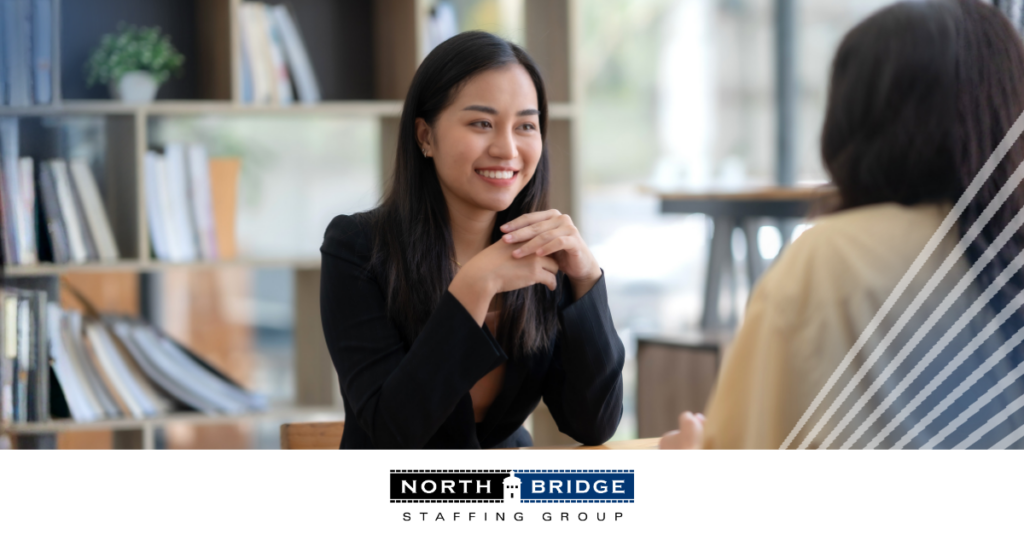 A candidate undergoes an interview with a recruiter, illustrating candidate vetting vs hiring speed