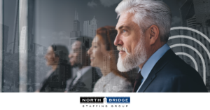 A group of professionals stands in a row, symbolizing the quality hires you can expect from a good recruiting partner.
