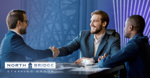 A recruiter and job applicant shake hands enthusiastically, illustrating a valuable long-term recruiter relationship.