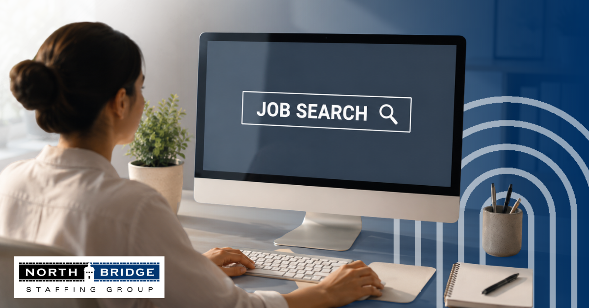 A woman sitting at a desktop computer with Job Search displayed on the screen.