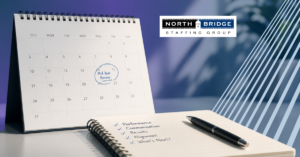 A calendar with Mid-Year Review circled and a notebook listing Performance, Communication, Results, Alignment, and What's Next.